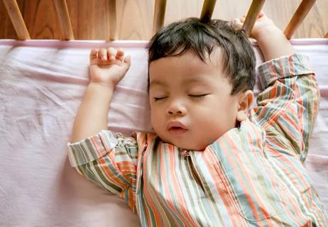 baby sleeping in crib