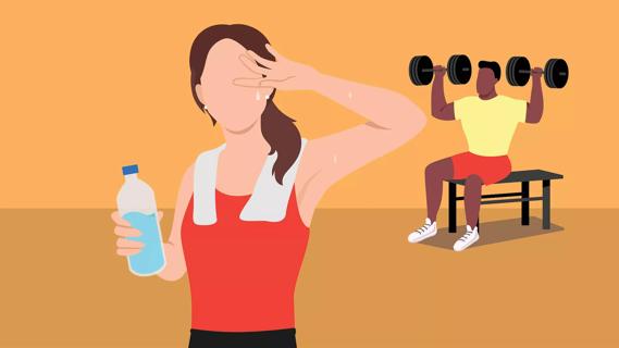 female sweating in gym with male lifting weights in background