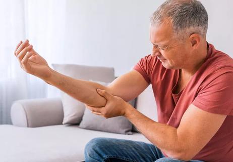 Older man suffering from a painful elbow