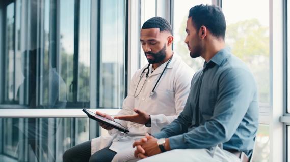 Physician speaking with patient