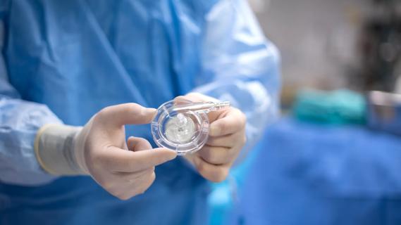 Surgeon holding VAD in the operating room