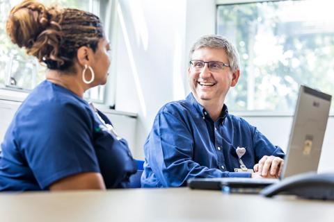 Nurses talking at table