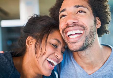 Closeup of a loving, laughing and hugging couple.