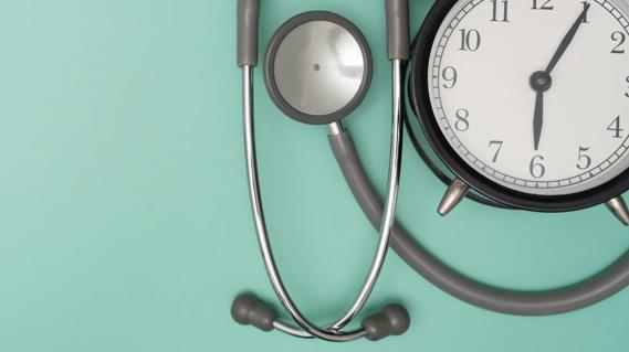 Illustration with a stethoscope and a clock