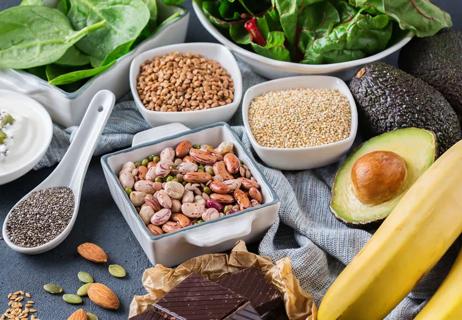 Magnesium rich foods including bananas, nuts, avocados and chocolate
