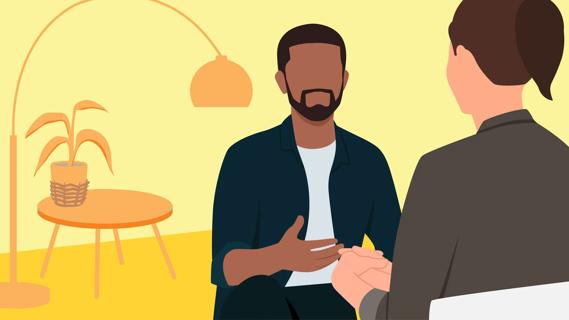 Therapist and patient talking in warm office setting