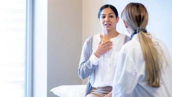 Female patient speaking with physician