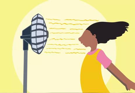 Child cooling off in front of a windy fan on a sunny day.