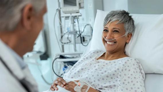 hospitalized woman talking to her doctor