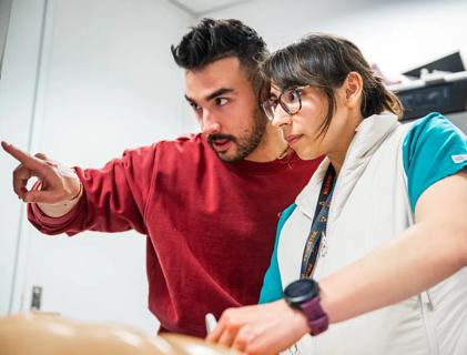 CCLCM graduates performing research in a skilled lab and simulation center.