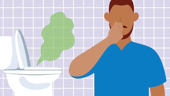 Person holding their nose against a bad smell coming from the toilet