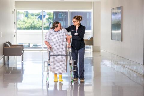 Racheal Jividen helping patient mobilize