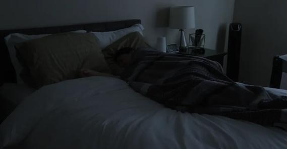 Person sleeping in bed