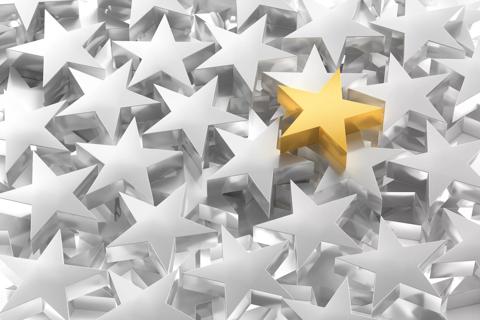 one gold star among many silver stars