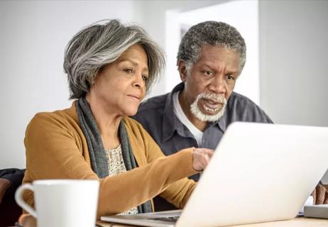 Elderly couple on computer