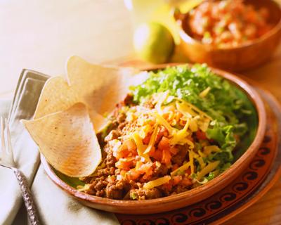 Taco salad and tortilla chips in a bowl