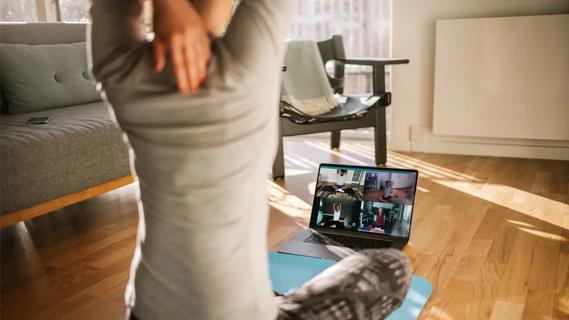 Woman doing virtual yoga