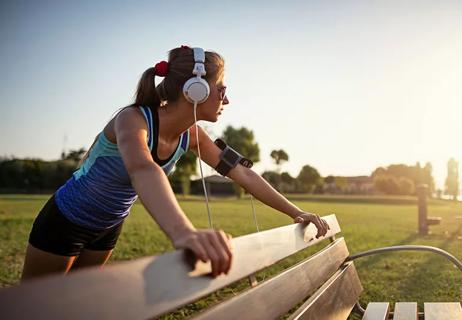 girl stretching at the park before a run