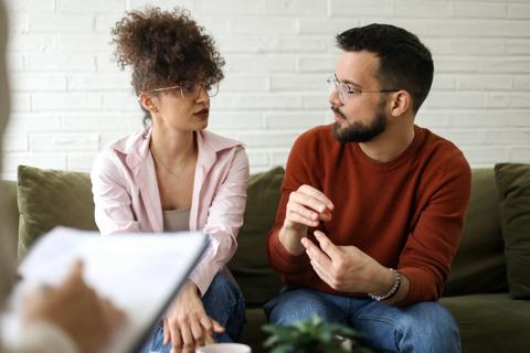 A couple speaking to a therapist