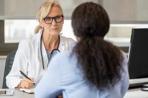 Doctor counseling female patient