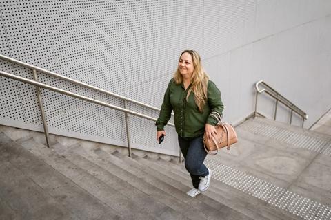 Person walking up flight of stairs outside