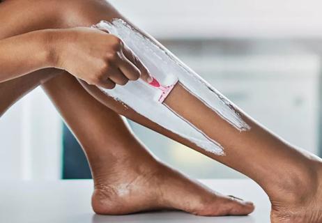 woman shaving legs
