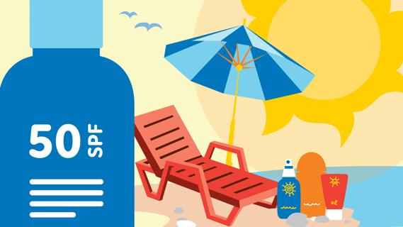 Beach chair on sunny beach, with umbrella and bottles of SPF
