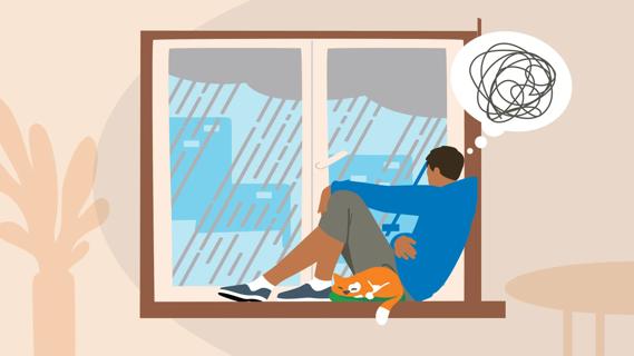 Troubled teen sitting on window sill, watching the rain