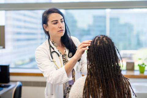 Dr. Littllejohn examining trial patient