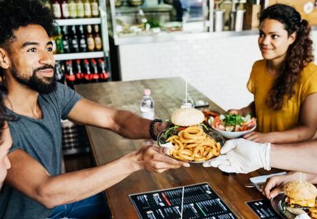 A couple eating at restaurant