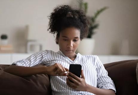 Teenage female on sofa.