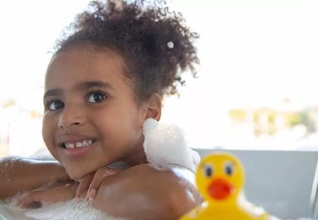 little girl in bubble bath