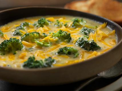 Bowl of creamy broccoli soup with cheese