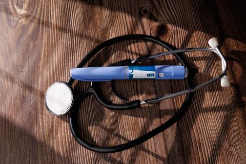 GLP-1 injection pen with a stethoscope