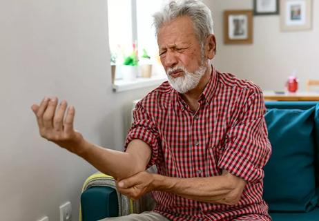 man with elbow pain