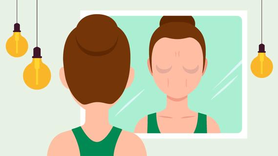 Person looking at face in mirror, seeing changes in their skin