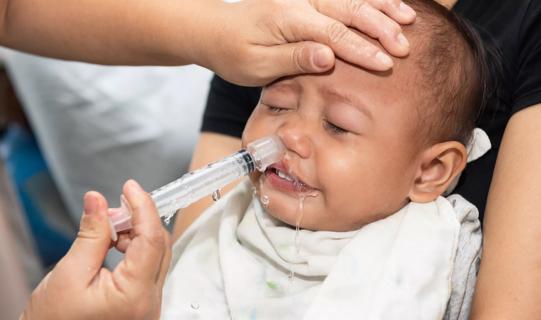 Baby getting nasal irrigation