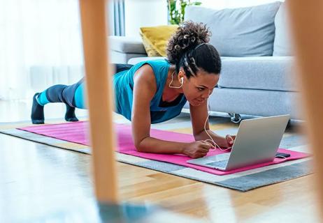 woman performing plank to ready for ski season