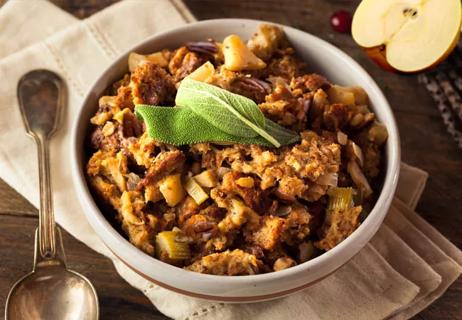 A bowl of whole-grain stuffing with apples, pears and toasted nuts.