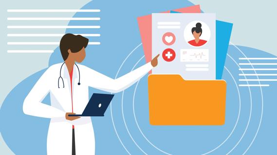 Healthcare provider holding laptop and pointing to oversized patient medical info