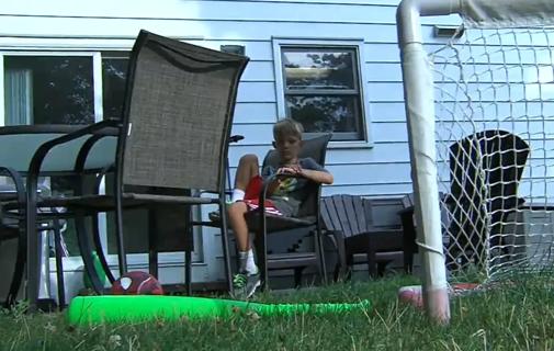 Boy sitting outside