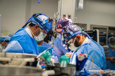 surgical team working at the operating table in an operating room