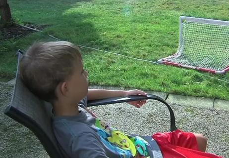 Child sitting outside