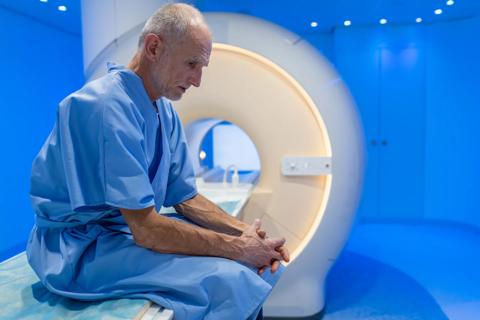 Elderly man waiting for CT scan