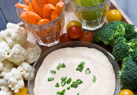 low-fat creamy Italian dip in bowl, with assorted veggies around
