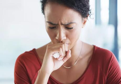 Woman coughing