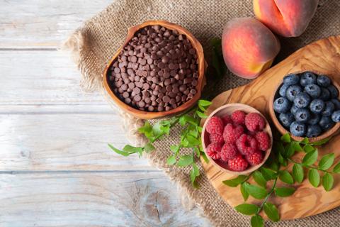 Raspberries, blueberries, peaches and chocolate chips, with mint