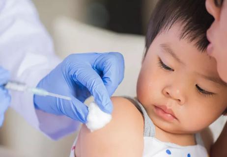 Small child receiving vaccine at doctor's office