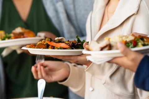 Person checking their hairline in the mirror