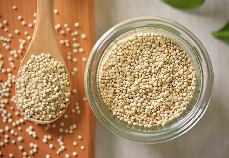 jar and spoonful of quinoa